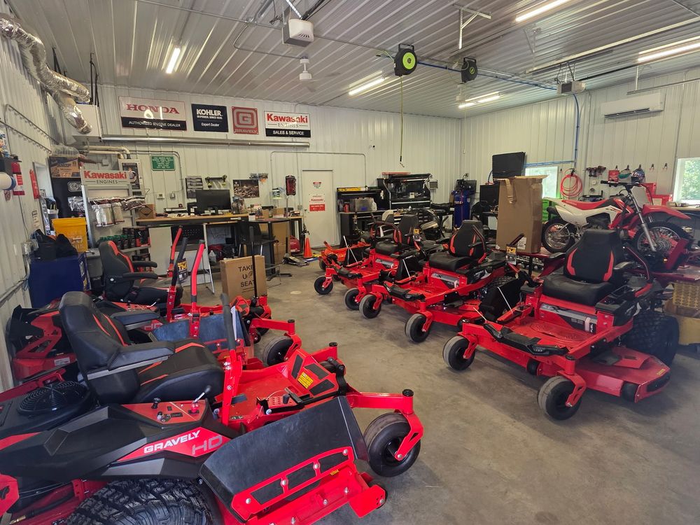 Gravely zero-turn mowers on the floor at Evans Repair in Pequot Lakes