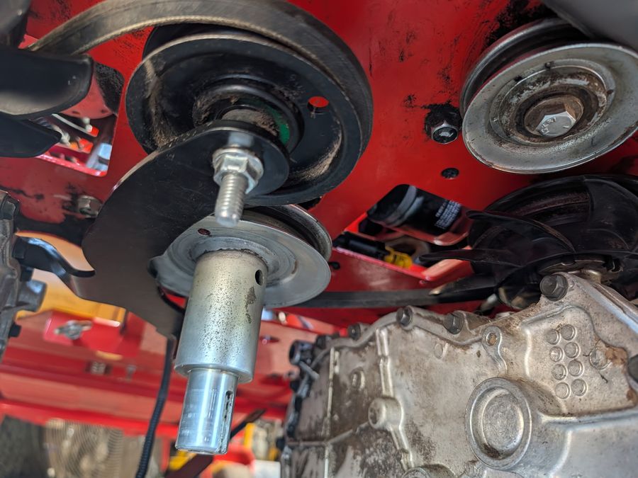 Spindle and drive belt replacement on a zero-turn mower deck